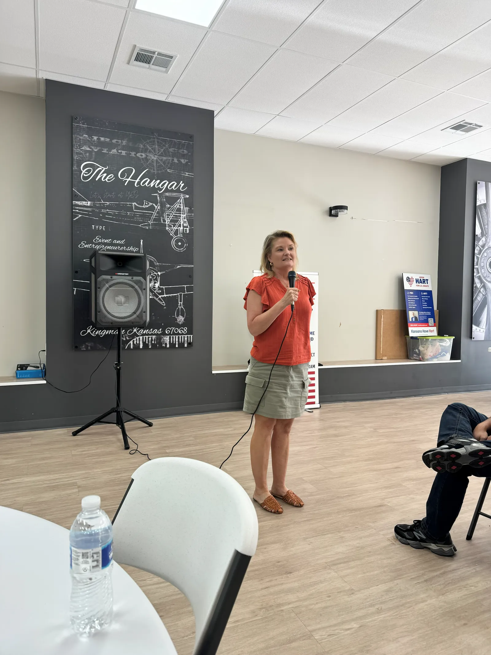A speaker addresses the crowd at The Hangar in Kingman, Kansas.