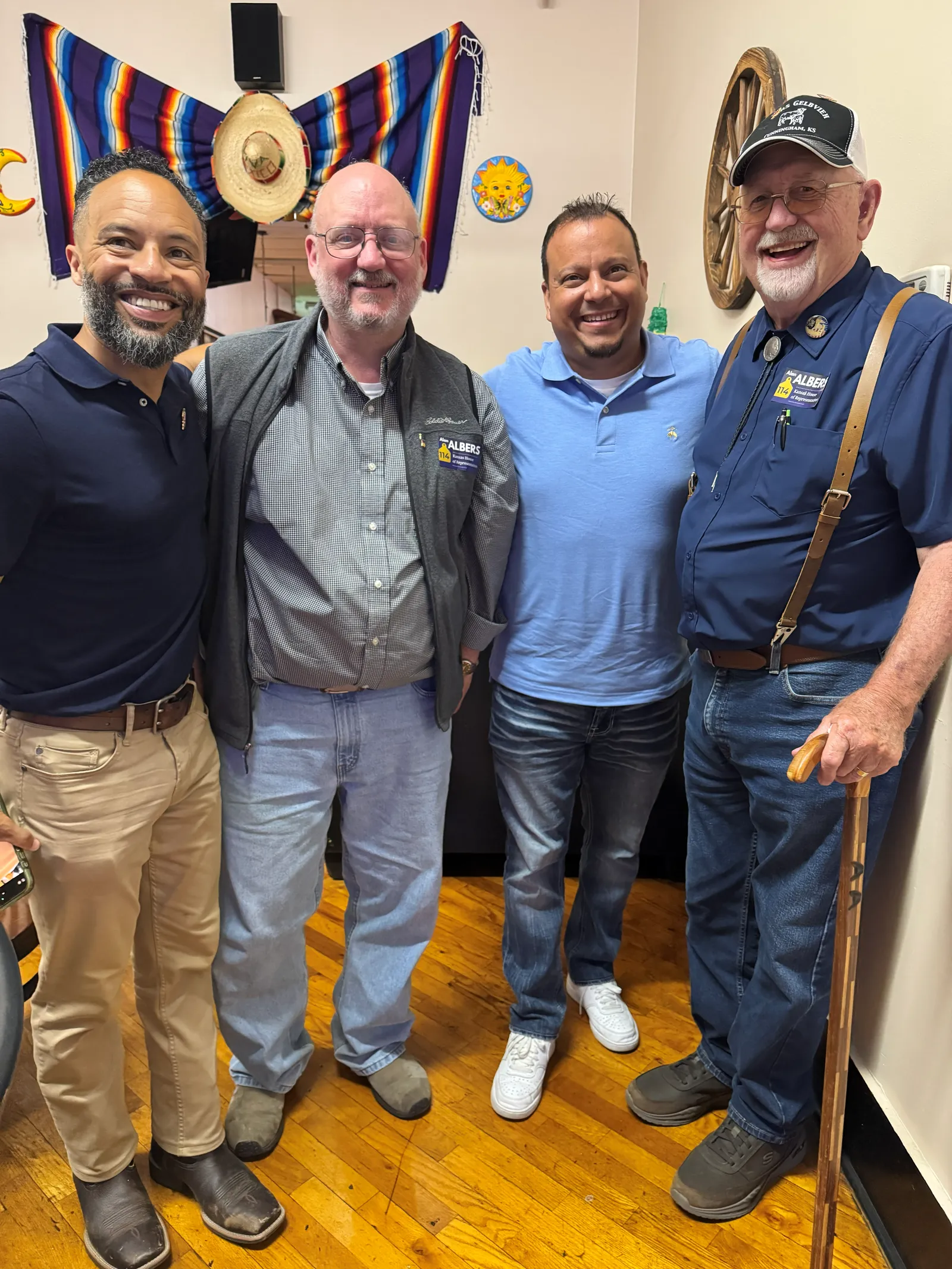 Juan C. Luengo with community members at a gathering in Kingman County.